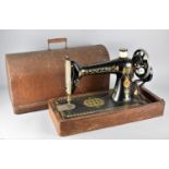 An Early 20th Century Manual Singer Sewing Machine in Oak Case, Serial Number Y1016527