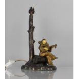 After Chiparus, A Bronze Figural Table Lamp Base in the form of Clown Playing Lute Under Tree, 34cms