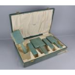 An Art Deco cased Shagreen Dressing Table Set with Pair of Hair Brushes, Pair Clothes Brushes and