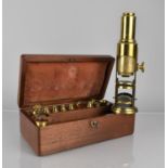 A Late Victorian/Edwardian Mahogany Cased Brass Field Microscope with Various Lenses, Slides and