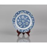 A 19th Century Chinese Porcelain Blue and White Plate Decorated with Floral Motif, Double Concentric