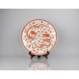 An Impressive 18th/19th Century Chinese Porcelain Charger decorated in Copper Red Enamels with