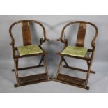 A Pair of Good Quality Chinese Hardwood Horseback Folding Chairs Having Brass Mounts and Carved