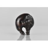 A Japanese Netsuke in the Form of a Goat, Signed, 4cms High