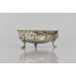 A Victorian Silver Bowl with Three Lion Mask Scrolled Supports and Repousse Work Decoration, 12cms