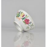 A Chinese Porcelain Bowl decorated in the Famille Rose Palette with Blooming Blowers and Bats,