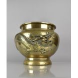 A 19th Century Cast Bronze Planter incised and Relief Decoration Dragon in Scrolled Sky, 29cms High,