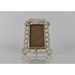 A Pressed White Metal Rectangular Easel Back Photo Frame with Swallows and Flower Decoration,