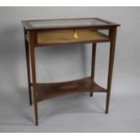 An Edwardian Inlaid Mahogany Bijouterie Table with Hinged Lifting Lid, Stretcher Shelf and on