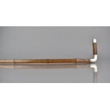 A Faux Bamboo Walking Stick of Square Section with White Metal Mounts, One Monogrammed The Other