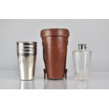 A Good Quality Leather Cased Drinking Set comprising Glass Spirit Flask and Four Regent Plate