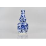 A Chinese Blue and White Double Gourd Vase decorated with Foliage, 19cms High