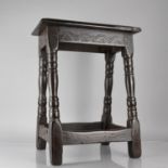 An 18th Century Oak Peg Jointed Stool with Carved Seat Rail and Four Turned Supports, Top 45x25cms