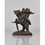 A 19th Century Carved Oak Black Forest Novelty Pipe Rest in the Form of Bear with Hollow Tree