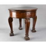 An Early 20th Century Low Drum table with a Solid Top Supported on Stylised Cabriole Legs and Claw