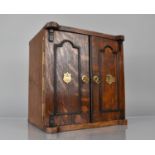 A Late 19th/Early 20th Century Oak Smoker's Cabinet having Panelled Doors with Brass Handles and