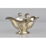 A Victorian Silver Two Handled and Lipped Sauce Boat by Finnigans Ltd, London, Hallmark 1860, 180gms