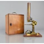 A 19th Century Cased Brass Compound Microscope with Spare Lenses, Accessories and Prepared Slides,