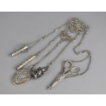 A Victorian/Edwardian Silver Chatelain, The Ornate Clasp with Pierced Floral and Scrolled Design