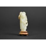A Chinese Carved Jade Study of an Immortal on Fitted Wooden Plinth, 7cms High. Condition:Not Perfect