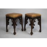 A Pair of Gothic Revival Oak Stools with Hide Upholstery