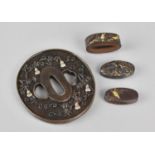 A Collection of Japanese Bronze and Mixed Metal Sword Mounts to Comprise Tsuba Housing Double