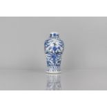 A 19th/20th Century Blue and White Porcelain Vase of Baluster Form decorated in a Floral and