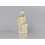 An 18th/19th Century Chinese Blanc De Chine Study of Immortal Standing Upon Temple Lion, 18cms High.