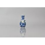 A Small Chinese Porcelain Blue and White Vase of Bottle Form decorated with Flower and Foliage