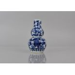A Small Porcelain Blue ad White Double Gourd Vase Decorated Foliage and Floral Motif, 10cms High