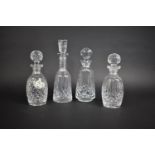 A Collection of Four Waterford Crystal Decanters, One With Ceramic Sherry Label by Coalport