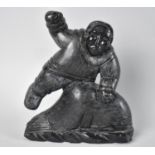 A Carved Inuit Soapstone Study of Eskimo with Whale Calf, 17.5cms High