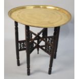 An Indian Brass Benaries Tray Set on Folding Stand, 57cms Diameter