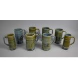 A Collection of Eight Various Large Wade Glazed Tankards