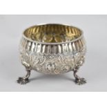 A Silver Sugar Bowl with Repousse Decoration on Three Feet, 171gms, London Hallmark