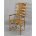 A Modern Pine Ladder Back Armchair with Rush Seat