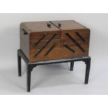 A Mid 20th Century Walnut Cantilevered Sewing Box with Contents, 54cms Wide