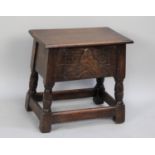 A Mid/Late 20th Century Oak Sewing Box of Stool Form with Hinged Lid, Front and Rear Panels Carved