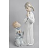 A Lladro Figure of Girl and Boy Saying Prayers, 22.5cms High