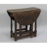 A Small 19th Century Oak Drop Leaf Oval Topped Gate Leg Table of Rustic Type, 75cms Wide