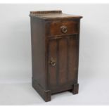 An Edwardian Oak Bedside Cabinet with Top Drawer over Cupboard Base, Small Loss of Veneer to Top,