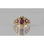 An Early 20th Century Three Stone Almandine Garnet and Gold Coloured Metal Ring, Unmarked but