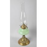 A Late 19th/Early 20th Century Brass Based Oil Lamp with Opaque Green Glass Reservoir and Plain