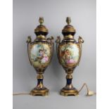 A Pair of Continental Cobalt Blue and Gilt Table Lamps in the Form of Two Handled Vases with Hand
