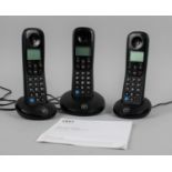 A Three Unit BT Digital Cordless Phone Set with Instructions