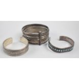 Three White Metal Bangles to Include Turquoise Mounted Navajo Type Example