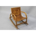 A 1950's/60's Child's Rocking Chair with Pokerwork Decoration