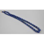 A Graduated Single Row Lapis Lazuli Bead Necklace, 63cm