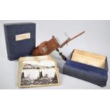 A Late Victorian/Edwardian stereoscopic viewer together with two sets of cards, Boer War and The