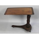 A Mid 19th Century Mahogany Cantilevered Reading or Writing Table with Rise and Fall Mechanism on